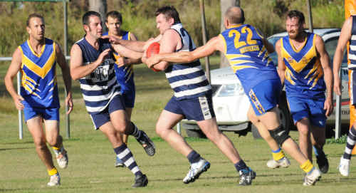 Cats player Billy Mitchell busts out of the pack on his way out of defence on Saturday. Cats player Billy Mitchell busts out of the pack on his way out of defence on Saturday.